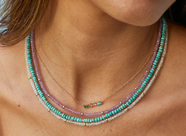 EF Collection birthstone beaded necklaces styled on neck of model in pink sapphire, turquoise, and moon stone