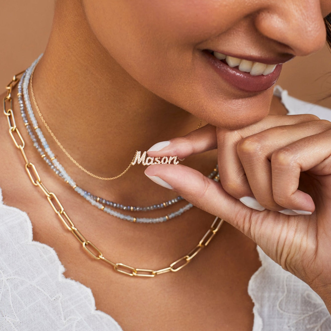 EF Collection 14k yellow gold necklaces with diamonds and gems styled on neck of model