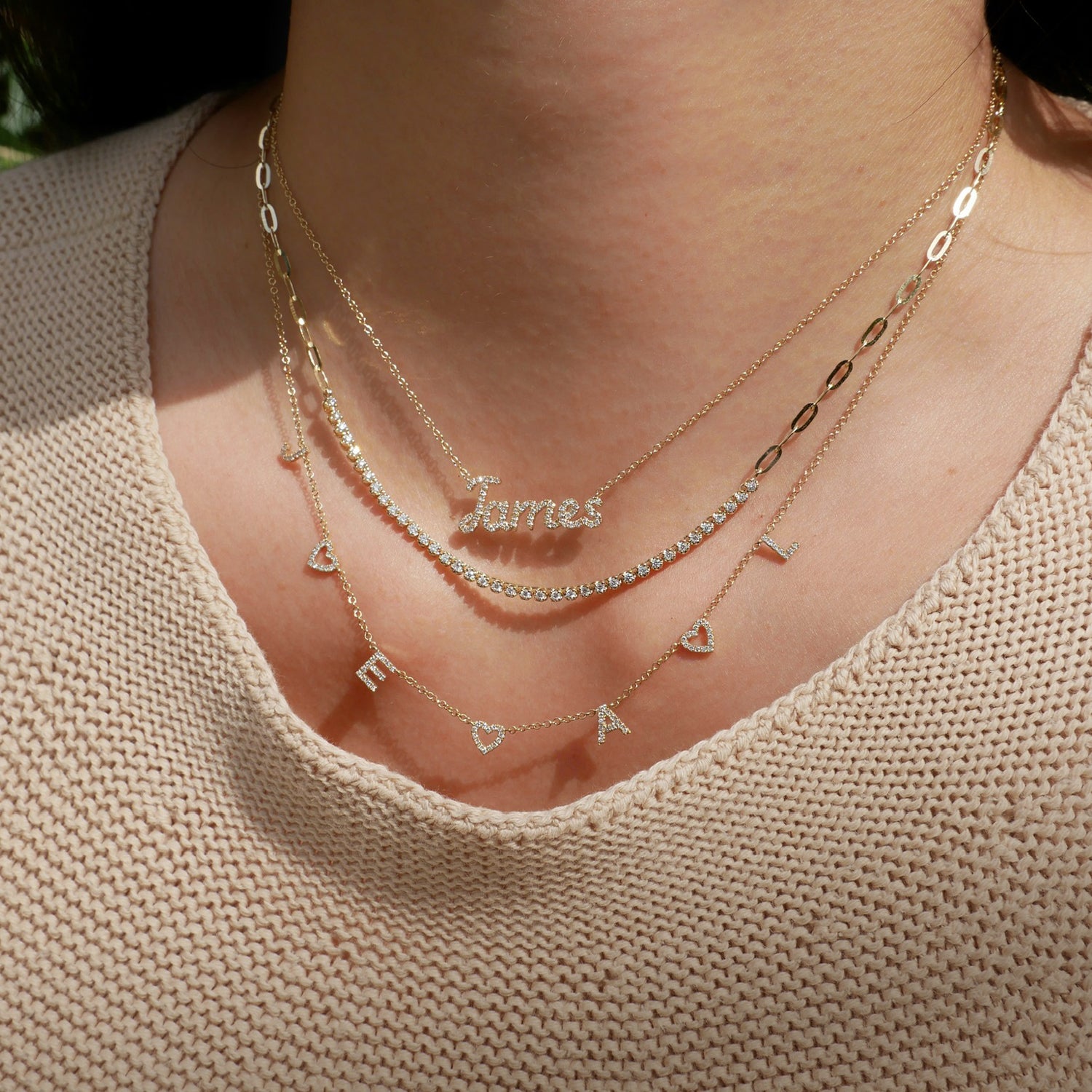 EF Collection 14k personalized necklaces with diamonds with initials JAMES and J E A and L styled on neck
