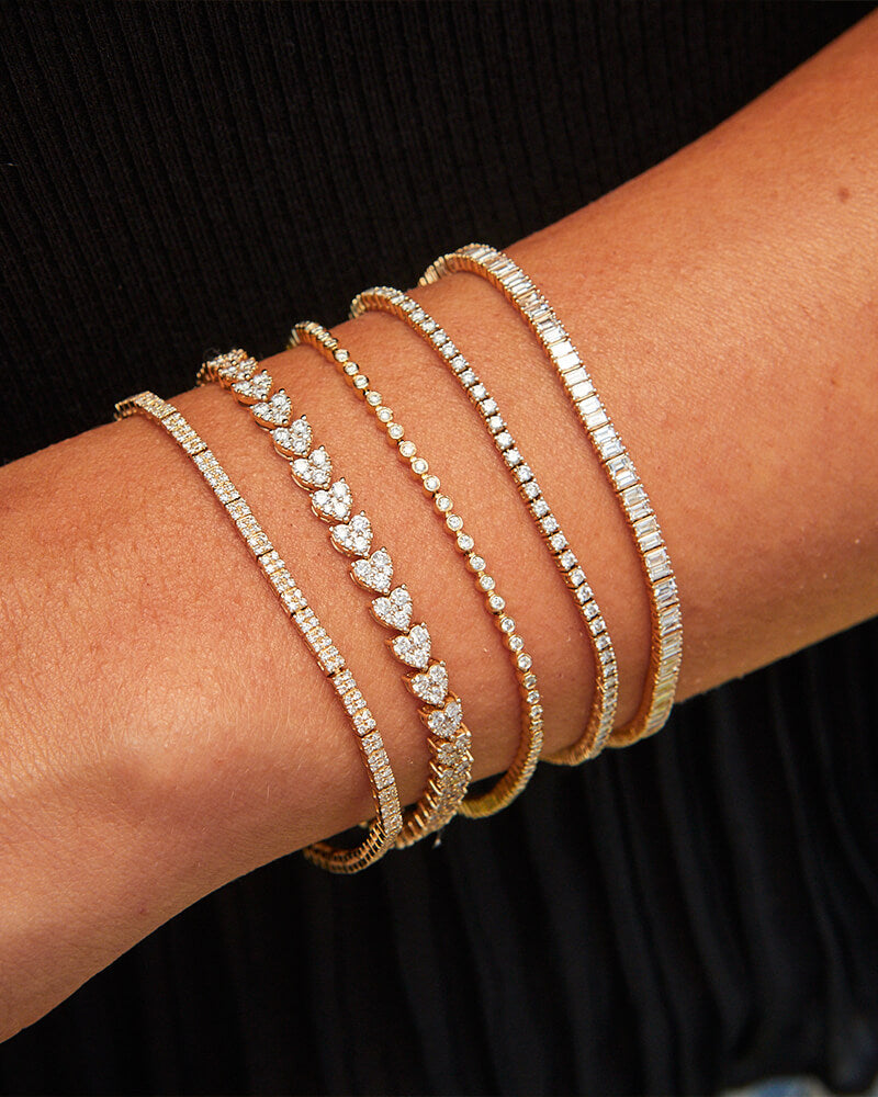 EF Collection 14k yellow gold and diamond bracelets styled on wrist of model