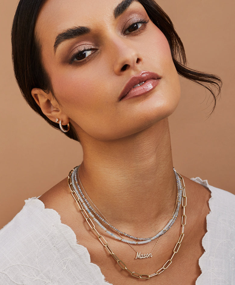EF Collection necklace sand earrings styled on model