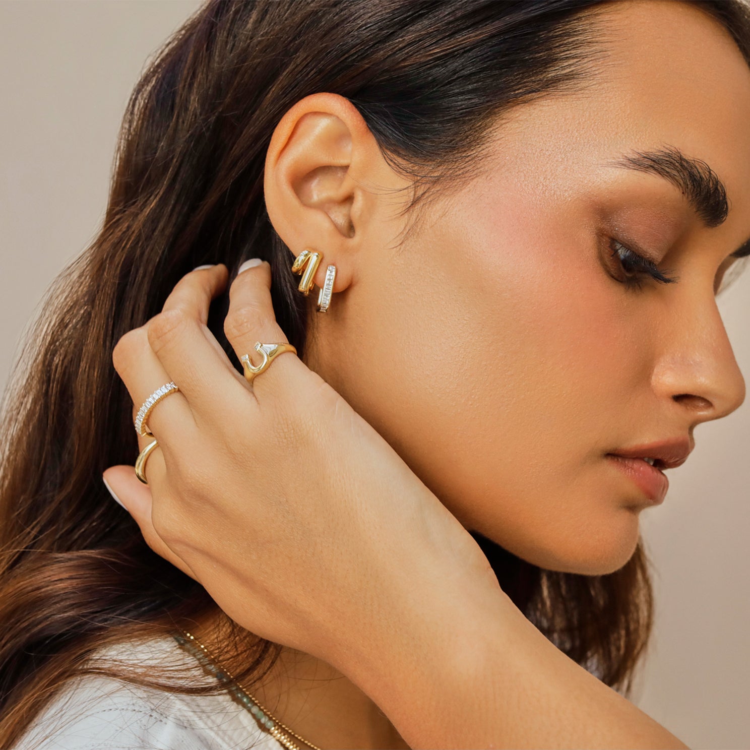 EF Collection 14k yellow gold earrings and rings styled on model