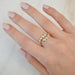 Graduated Diamond Pillow Wrap Ring in 14k yellow gold styled on middle ring of model