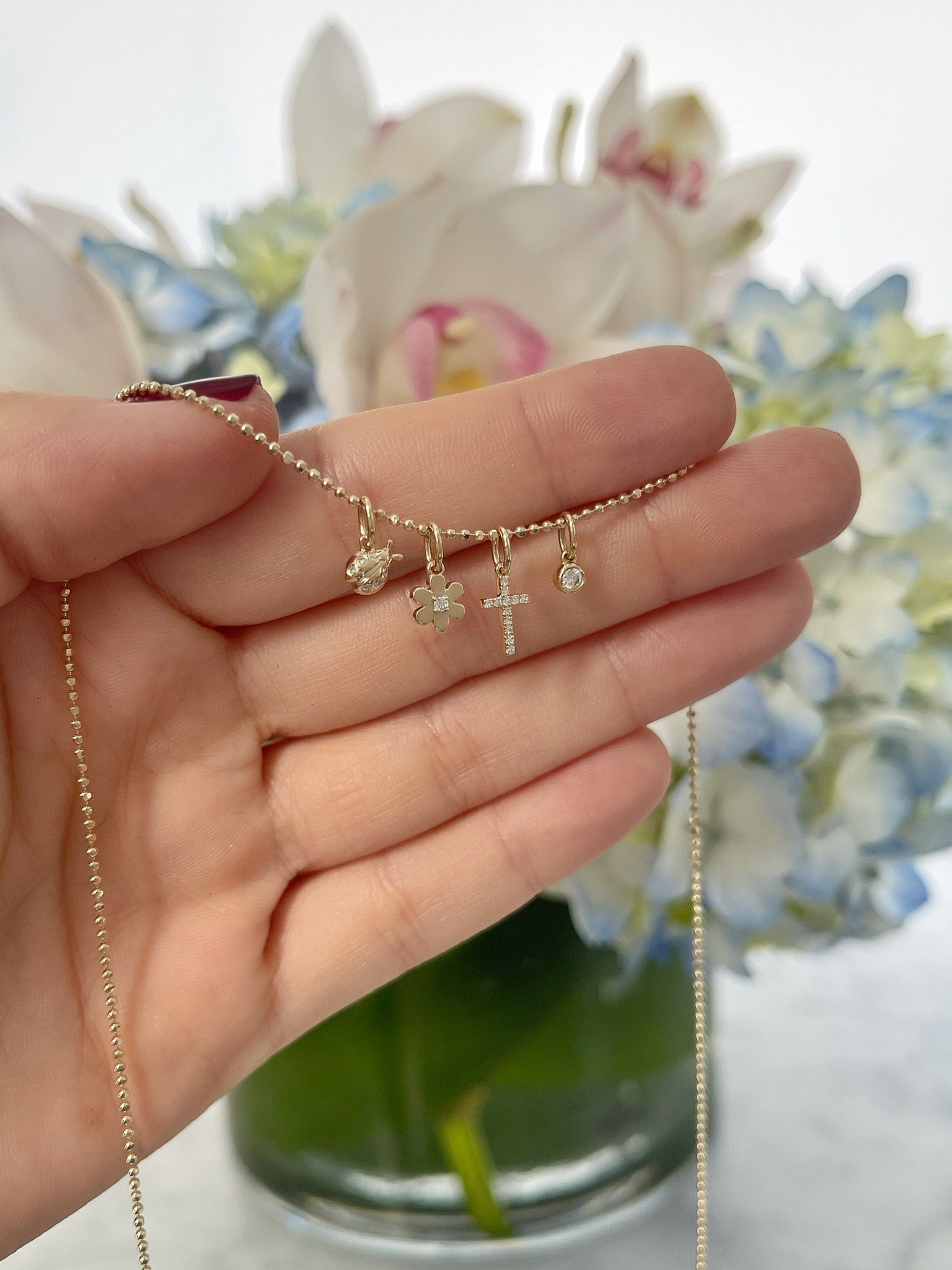 Diamond Cross Necklace Charm on charm necklace with three diamond charms