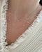 Love Around the Neck Necklace styled on the neck in yellow gold