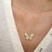 Pavé Diamond Jumbo Butterfly Necklace in 14k yellow gold styled on neck of model