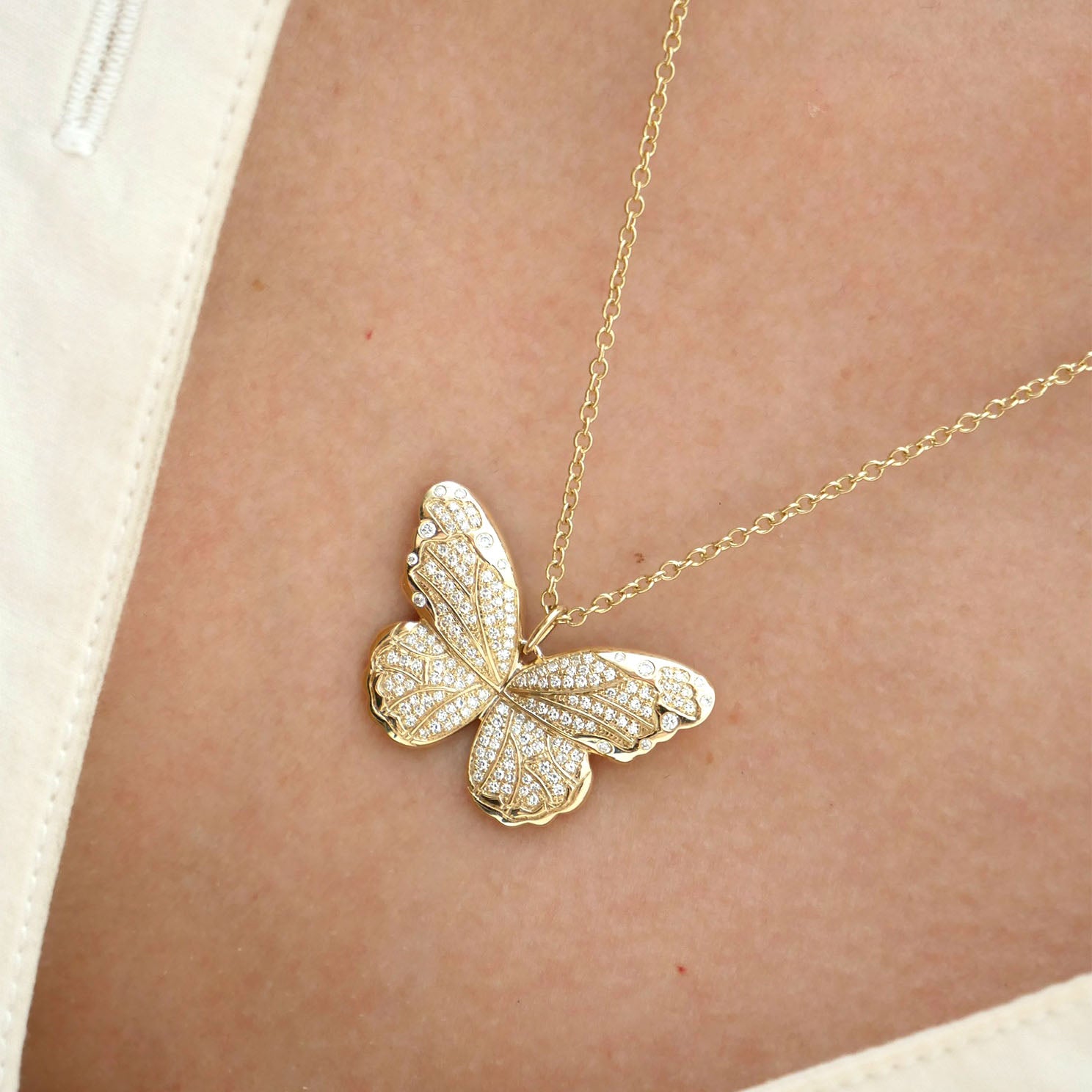 Pavé Diamond Jumbo Butterfly Necklace in 14k yellow gold styled on neck of model