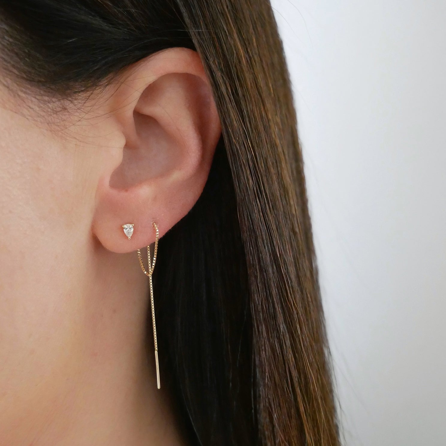 Pear Diamond Liquid Gold Threader Earring styled on ear lobe of model