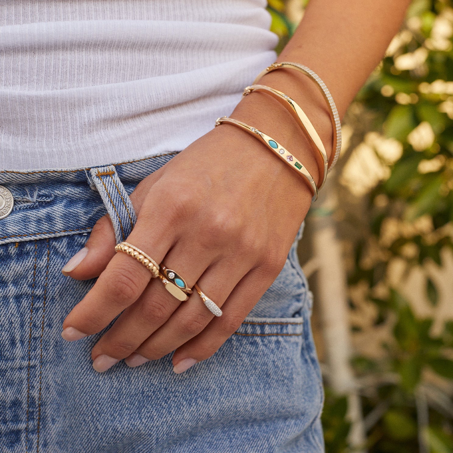 Pavé Diamond Treasure Ring styled on finger with gold and diamond rings