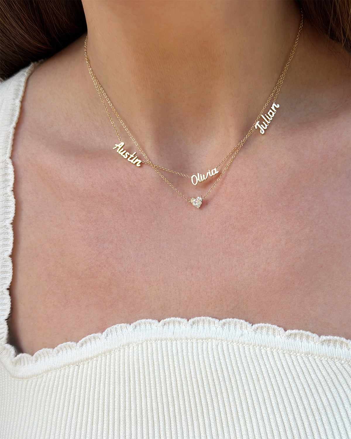 Personalized Mini Gold Script Name Necklace in Yellow Gold with Austin, Olivia, and Julian and Full Cut Heart Diamond Necklace