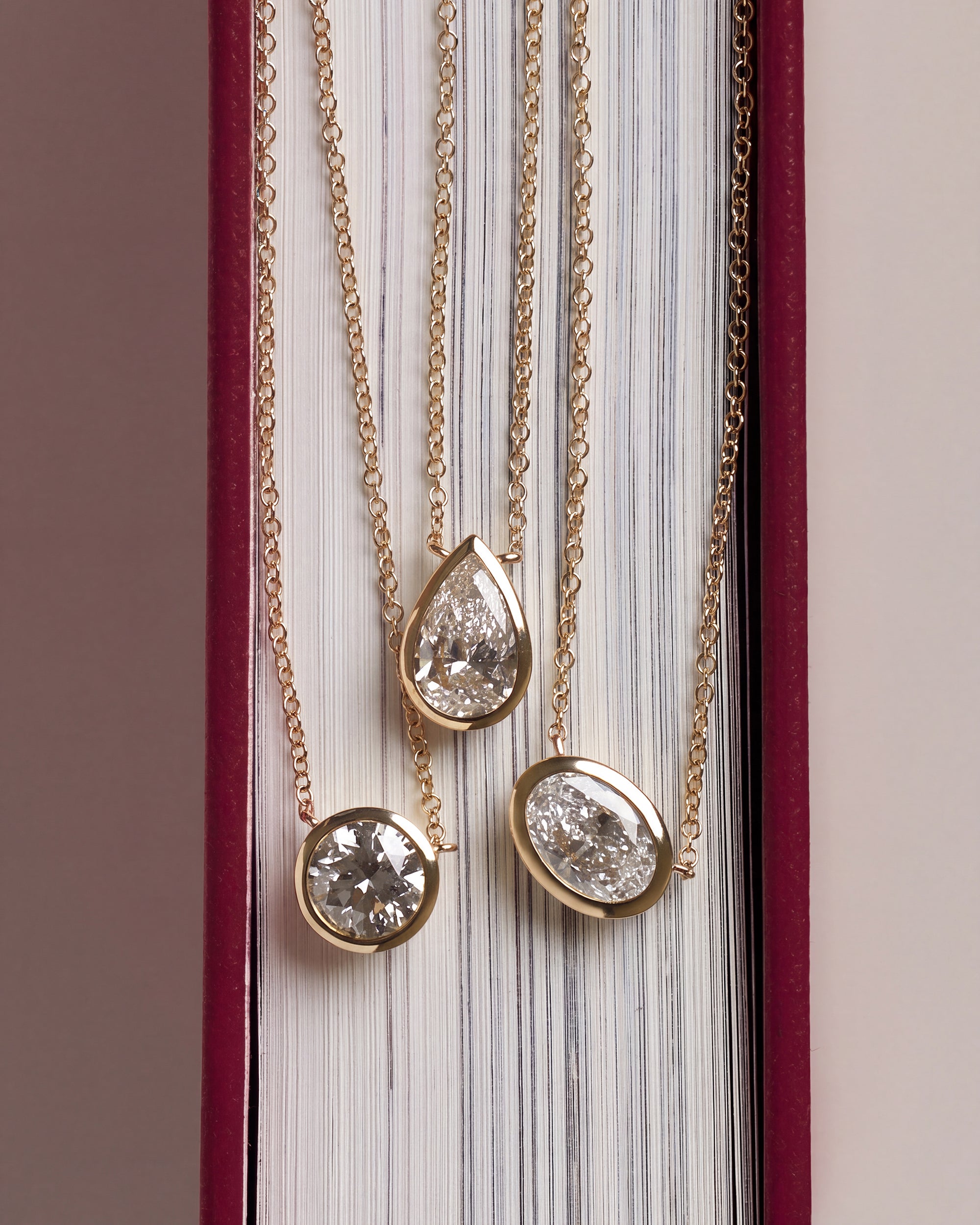 Floating Bezel Set Oval Diamond Necklace