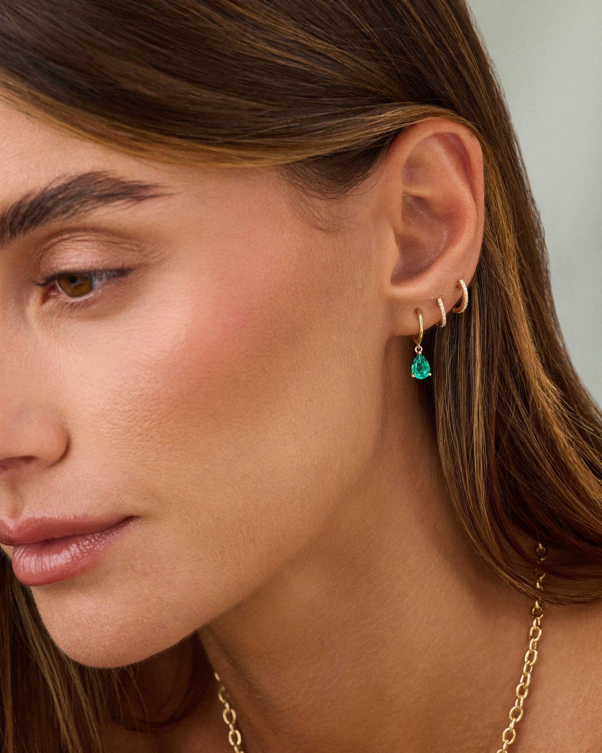 Emerald Pear Drop Huggie Earrings