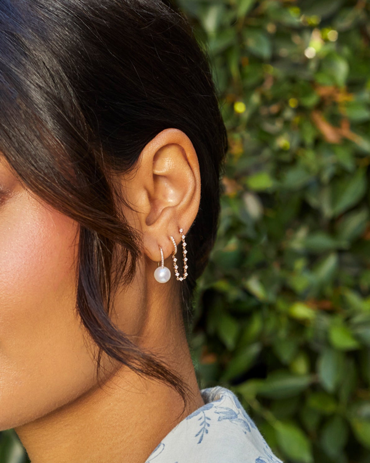 Pearl Ball Drop Earrings in 14k yellow gold styled on first earring hole of model