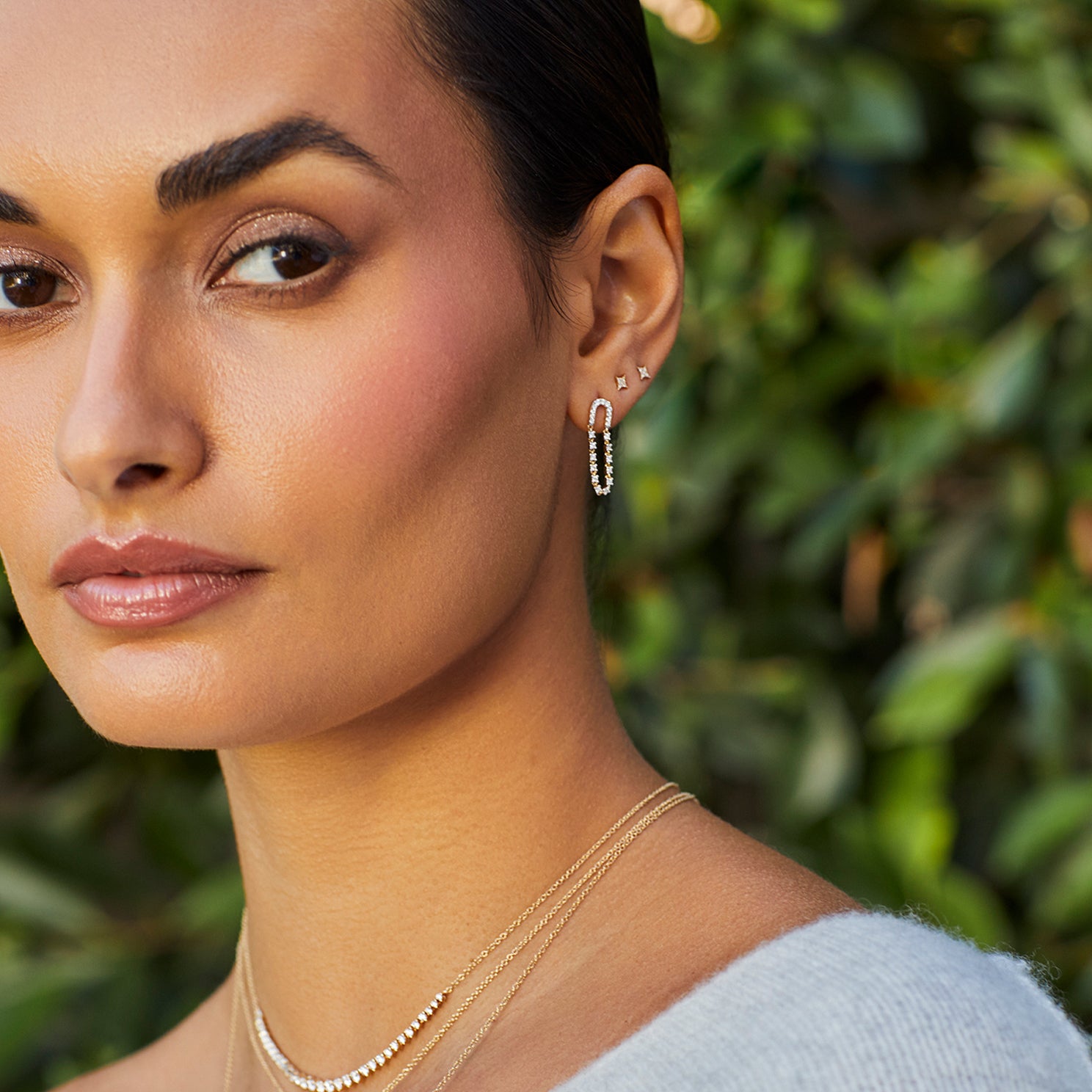 Diamond Loop Chain Stud Earring in 14k yellow gold styled on first earring hole of model