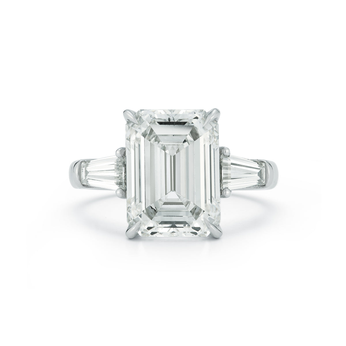 The Lauren Engagement Ring with emerald cut center stone and emerald cut stones on either side with platinum band