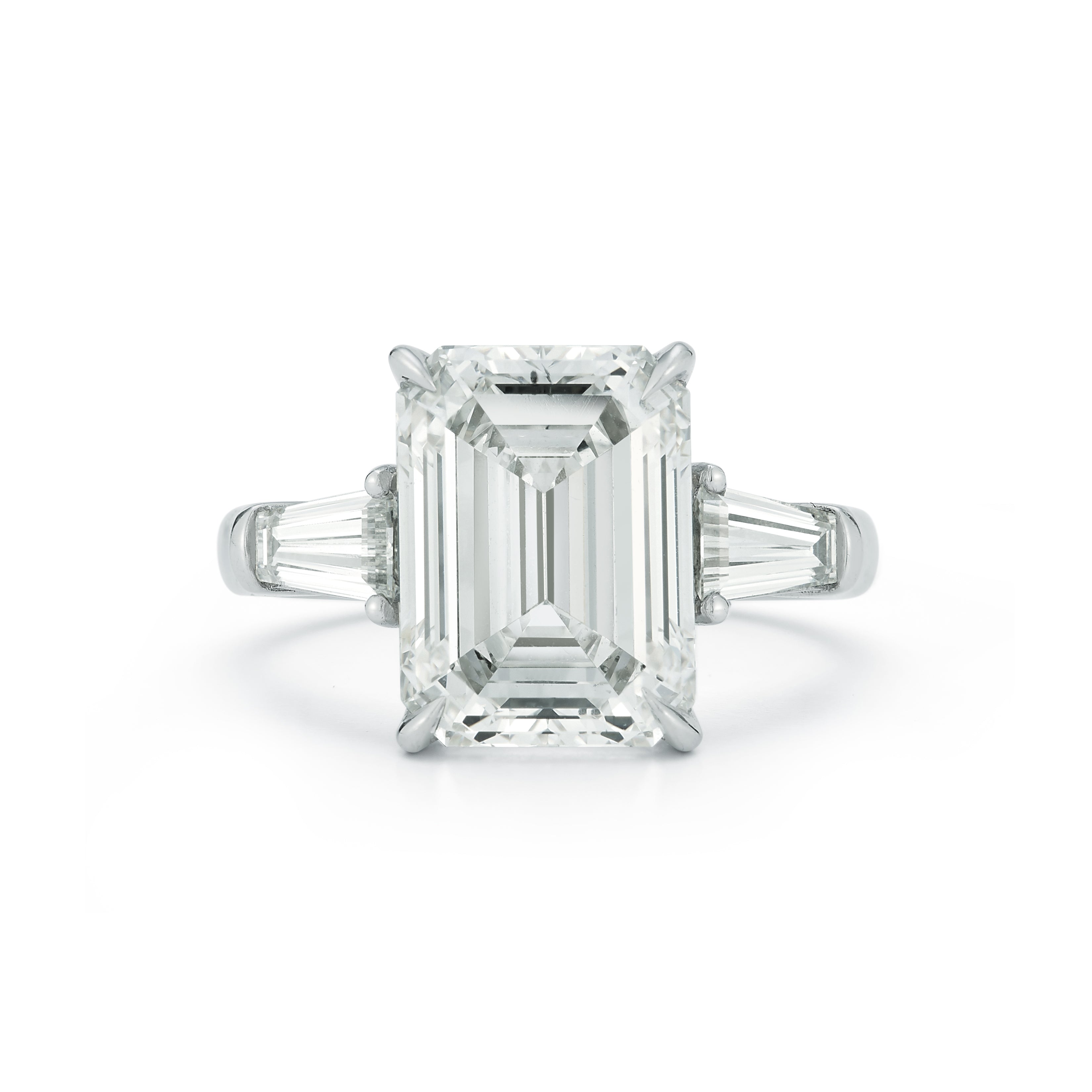 The Lauren Engagement Ring with emerald cut center stone and emerald cut stones on either side with platinum band