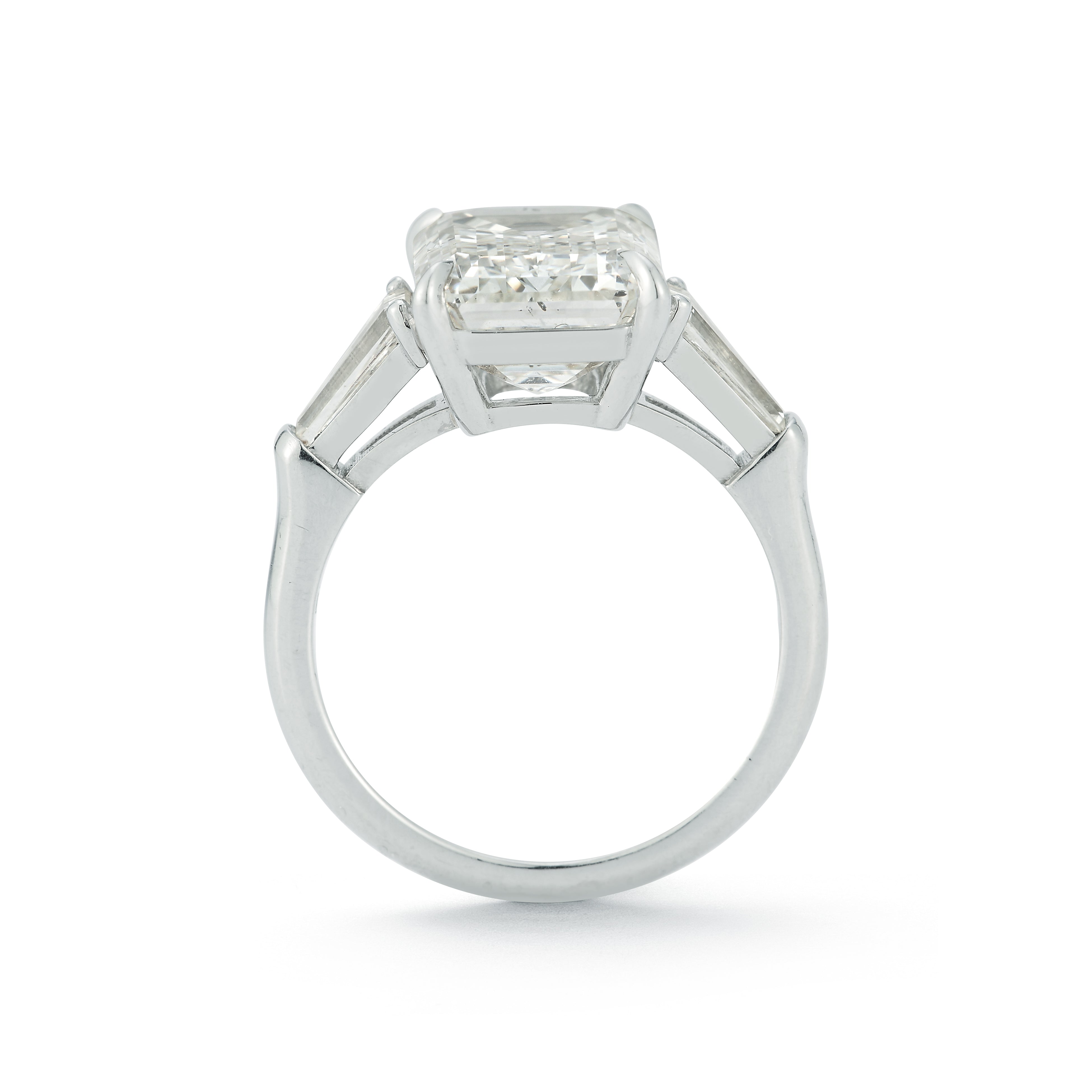 The Lauren Engagement Ring with emerald cut center stone and emerald cut stones on either side with platinum band