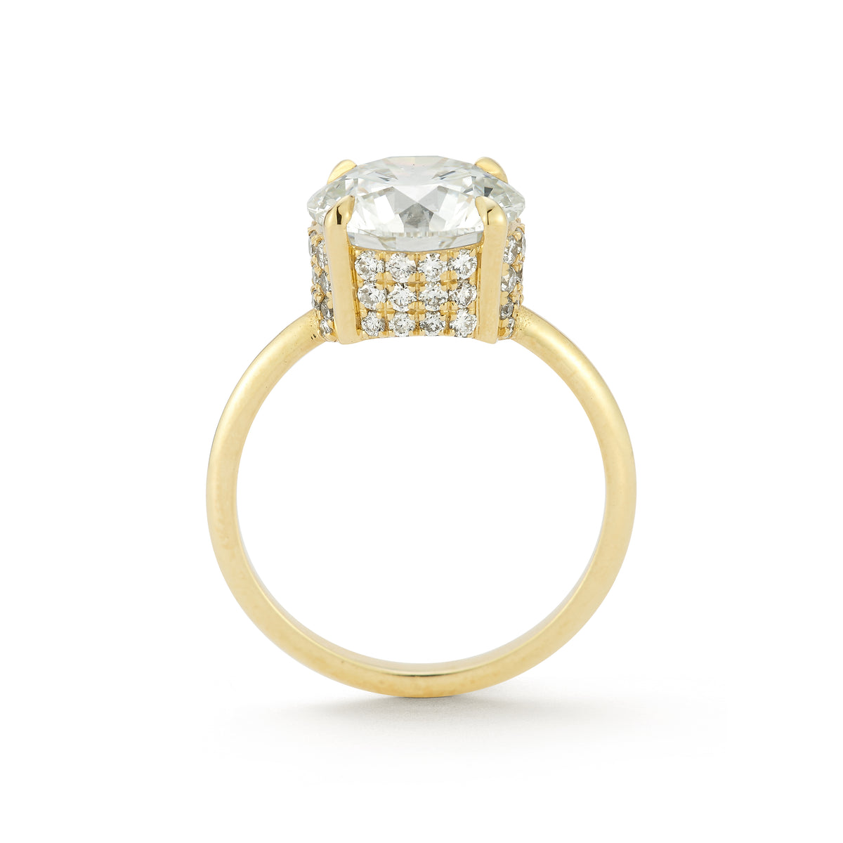 The Lindsay Engagement Ring with round center diamond, basket covered in pave diamonds, and yellow gold band