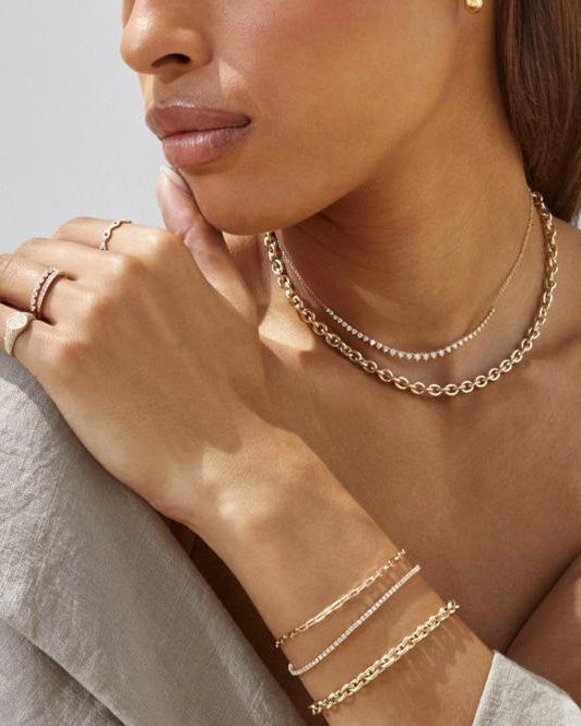 EF Collection 14k yellow gold necklaces, rings, and bracelets styled on model