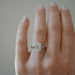 The Jamie Engagement Ring with emerald cut center diamond and platinum band