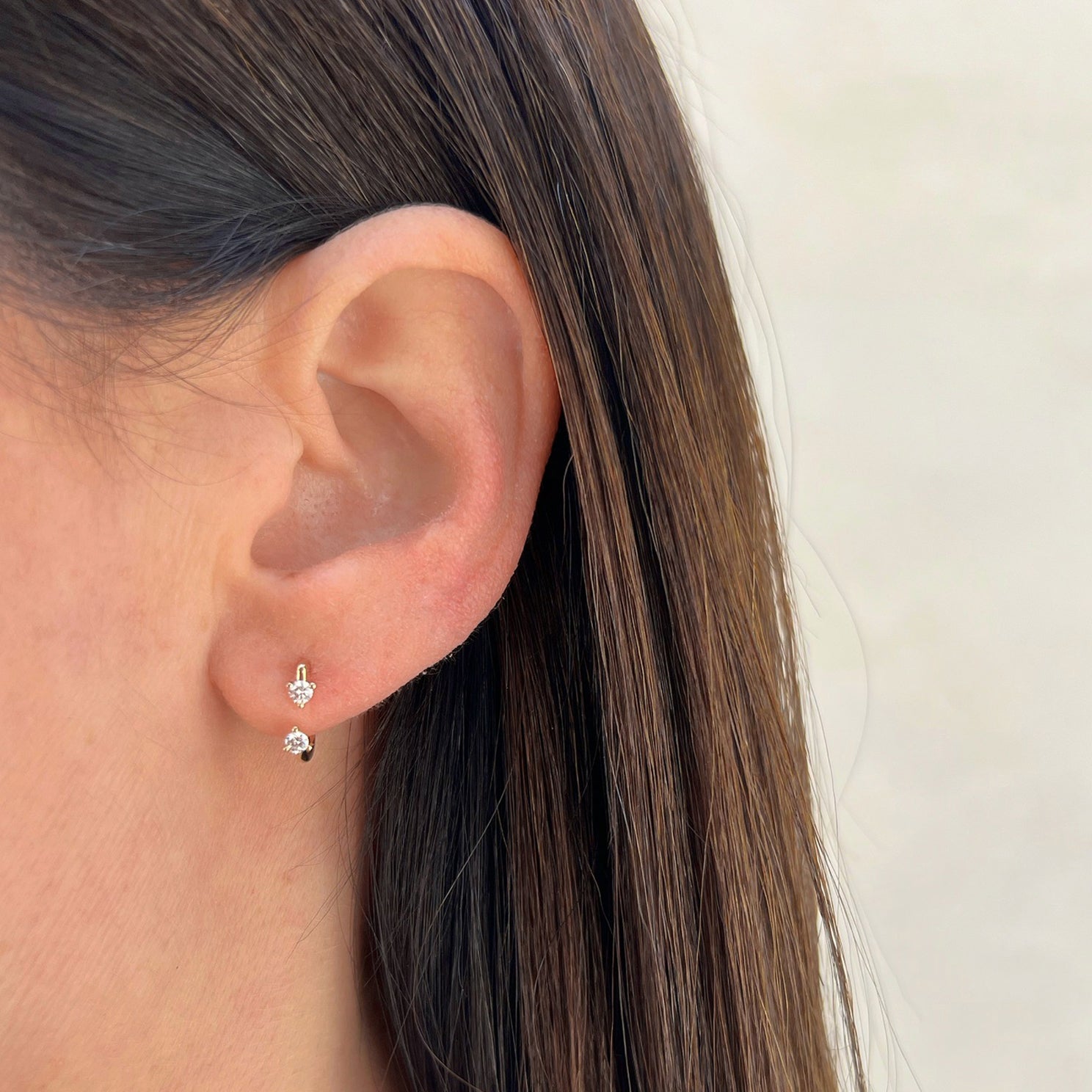 Double Prong Set Diamond Earring styled on ear of model
