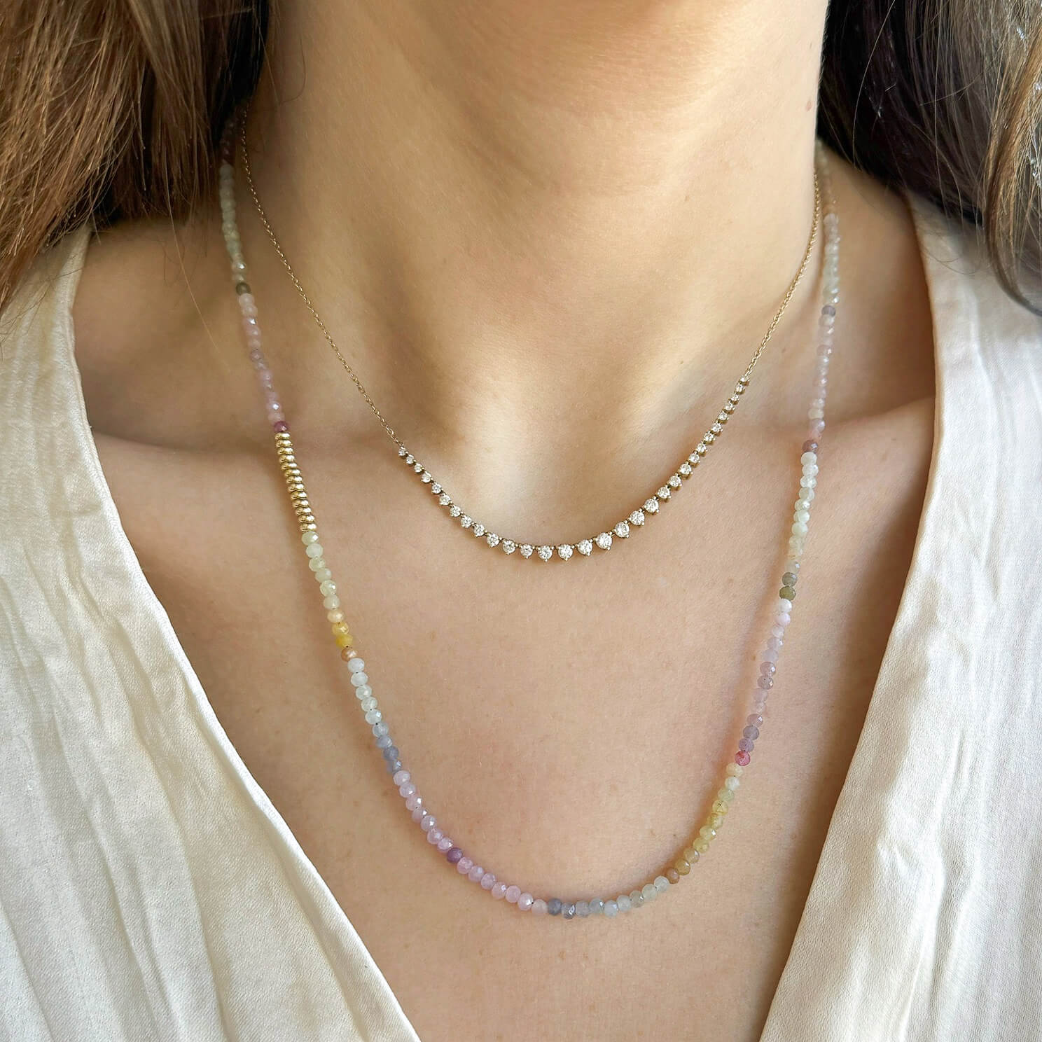 Ombré Sapphire Birthstone Bead Necklace & Triple Wrap Bracelet in 14k yellow gold styled on neck of model with graduated diamond necklace