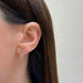 Diamond Drip Stud Earring in 14k yellow gold styled on ear lobe of model