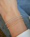 Diamond Segment Mini Link Bracelet in 14k white gold, rose gold, and yellow gold styled on wrist of model
