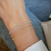 Diamond Segment Mini Link Bracelet in 14k white gold, rose gold, and yellow gold styled on wrist of model