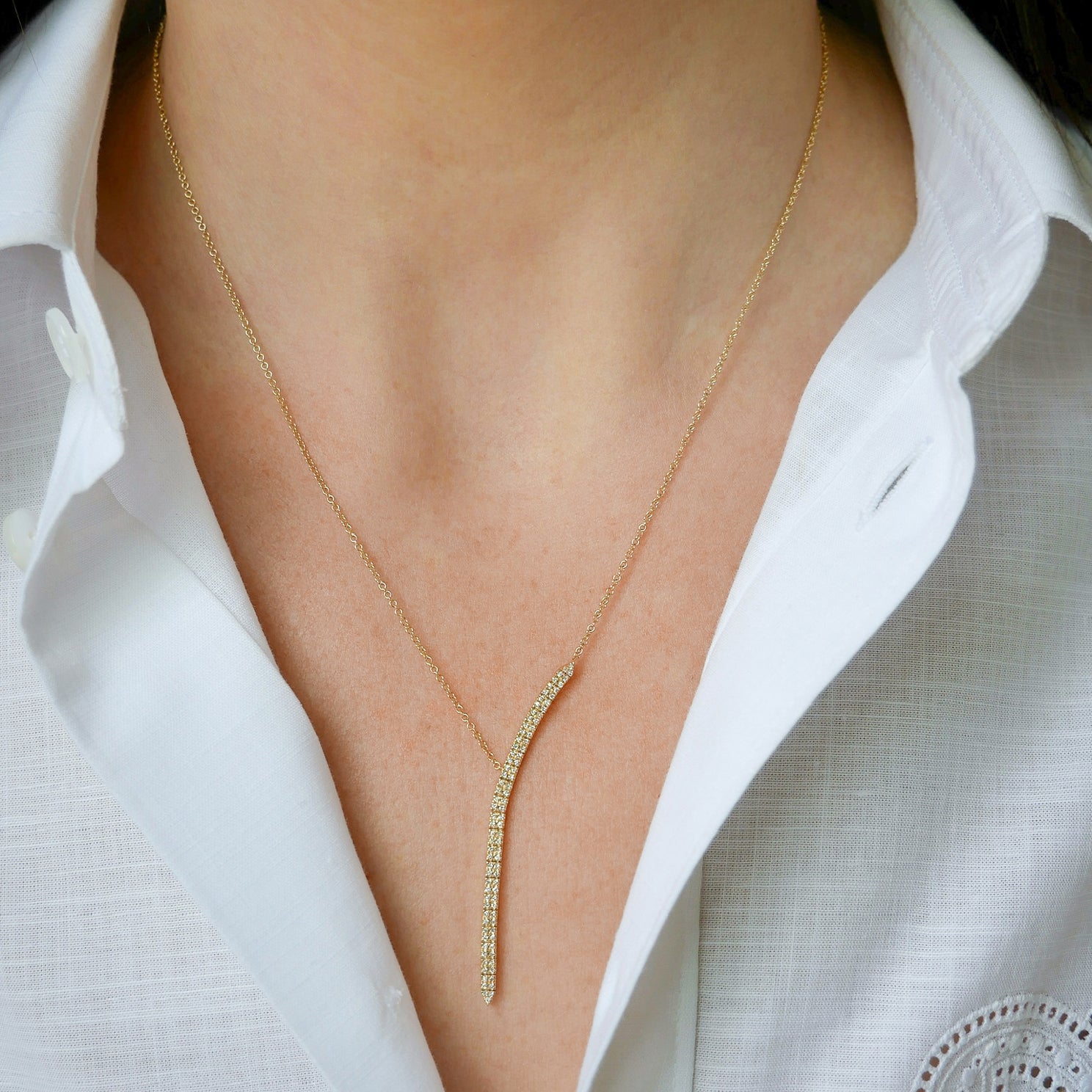 Diamond Double Row Waterfall Necklace in 14k yellow gold styled on neck of model with white button down blouse