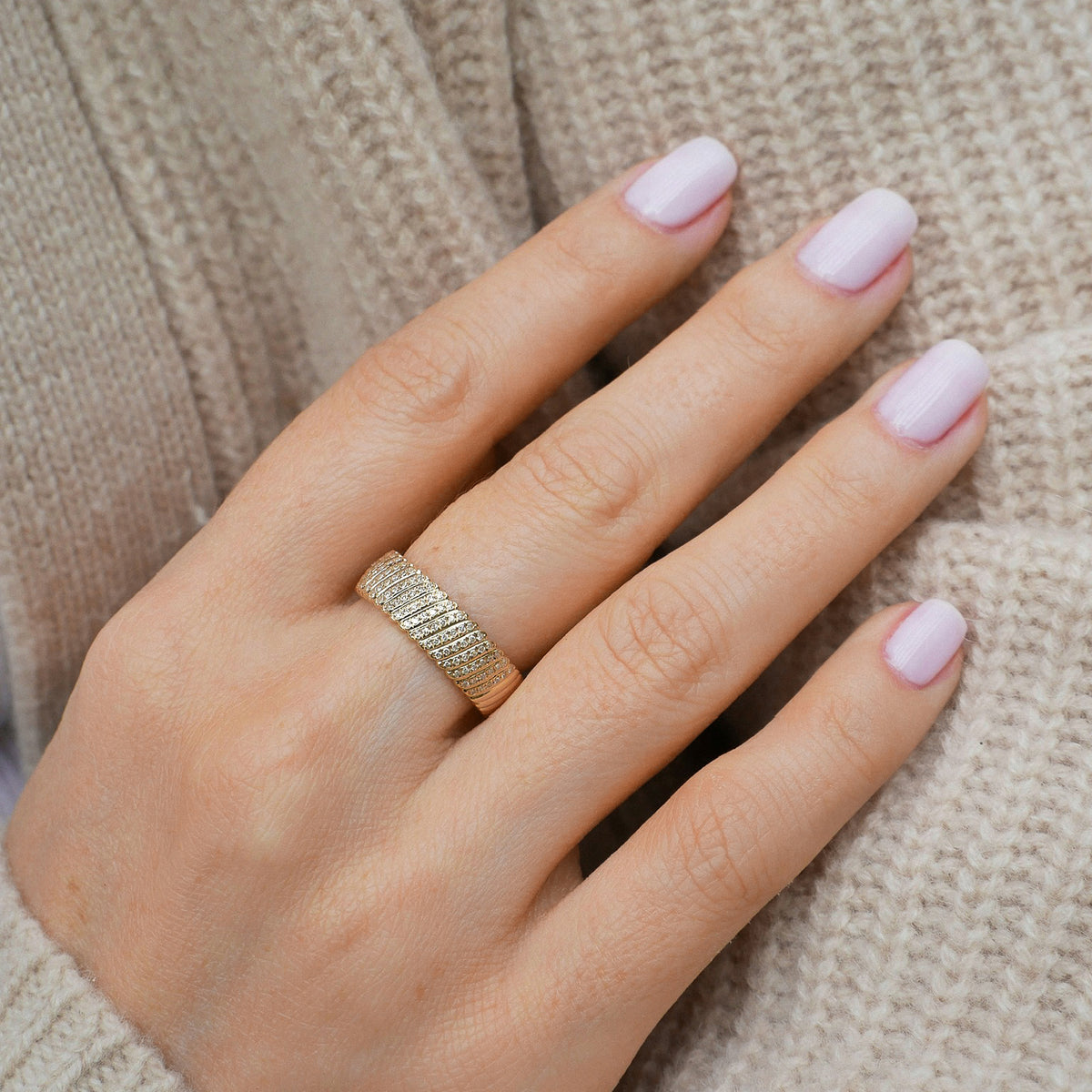 Diamond Jumbo Twist Ring in 14k yellow gold styled on middle finger of model