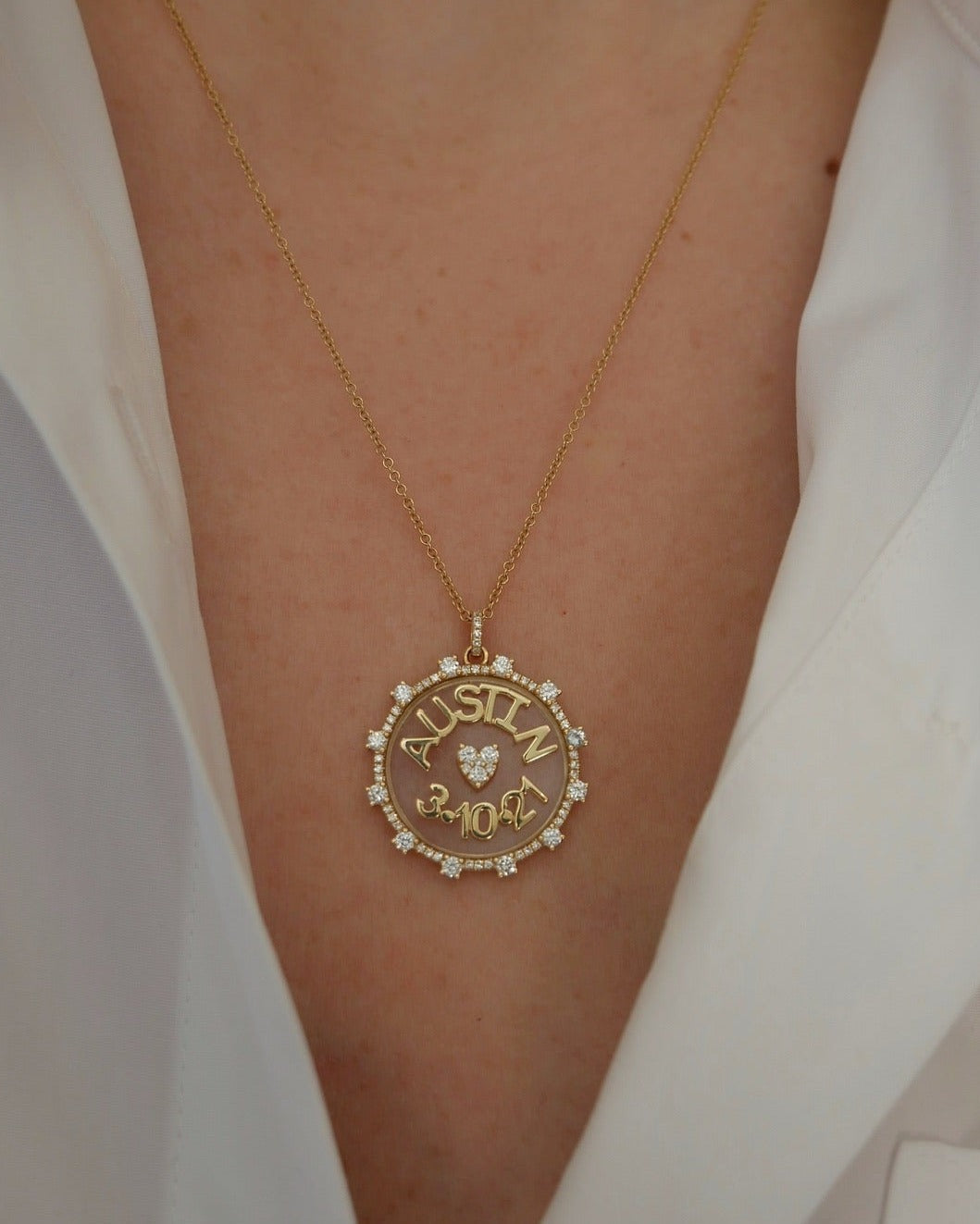 Floating Name & Date Necklace in 14k yellow gold with initials AUSTIN and date 3.10.21 styled on neck of model