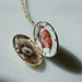 Gold and Diamond Oval Locket Necklace opened with photo of dog and of baby inside