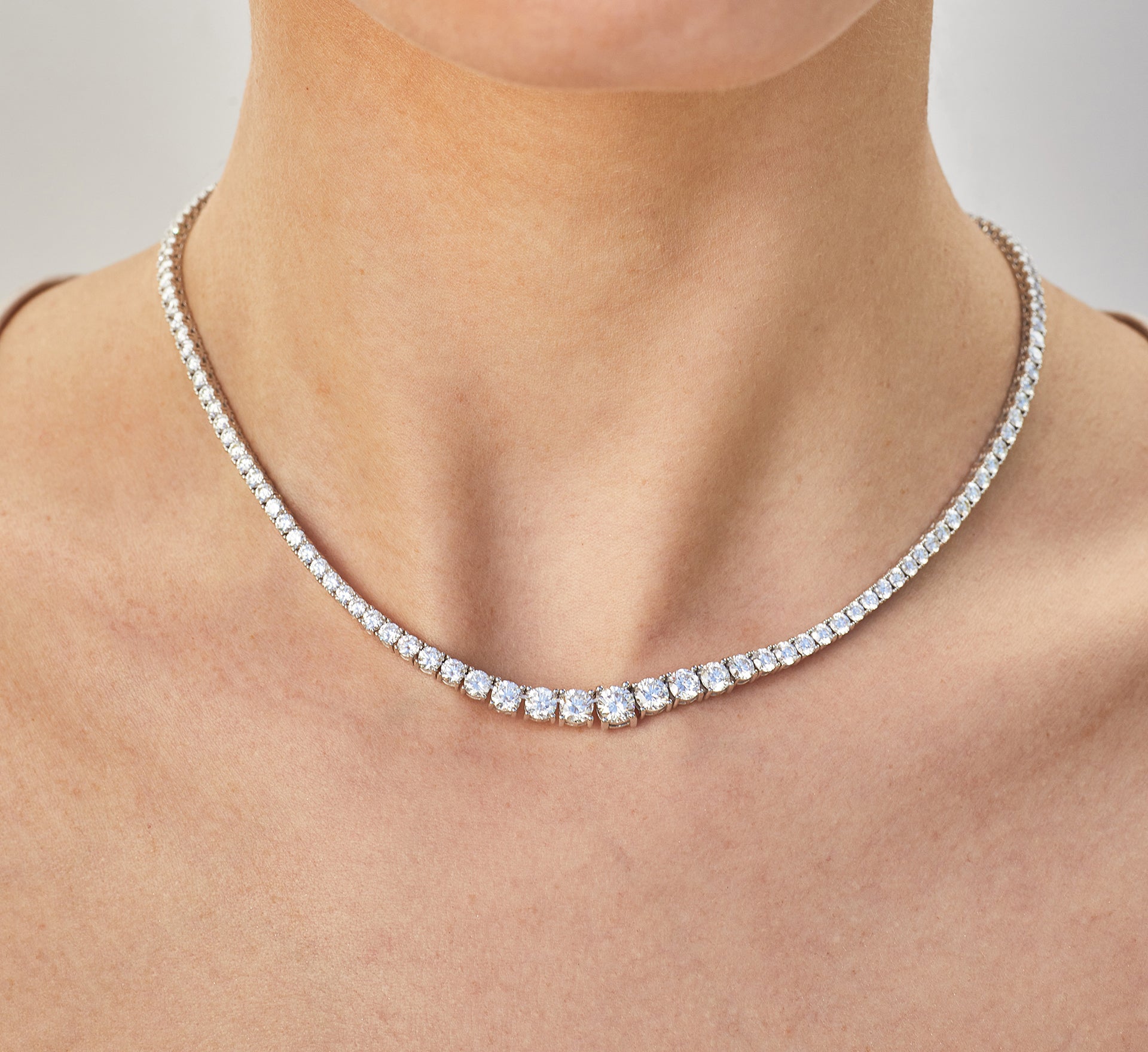 EF Collection diamond riviera tennis necklaces styled on neck of model