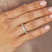 Oval Diamond Eternity Band with platinum setting styled on ring finger of model