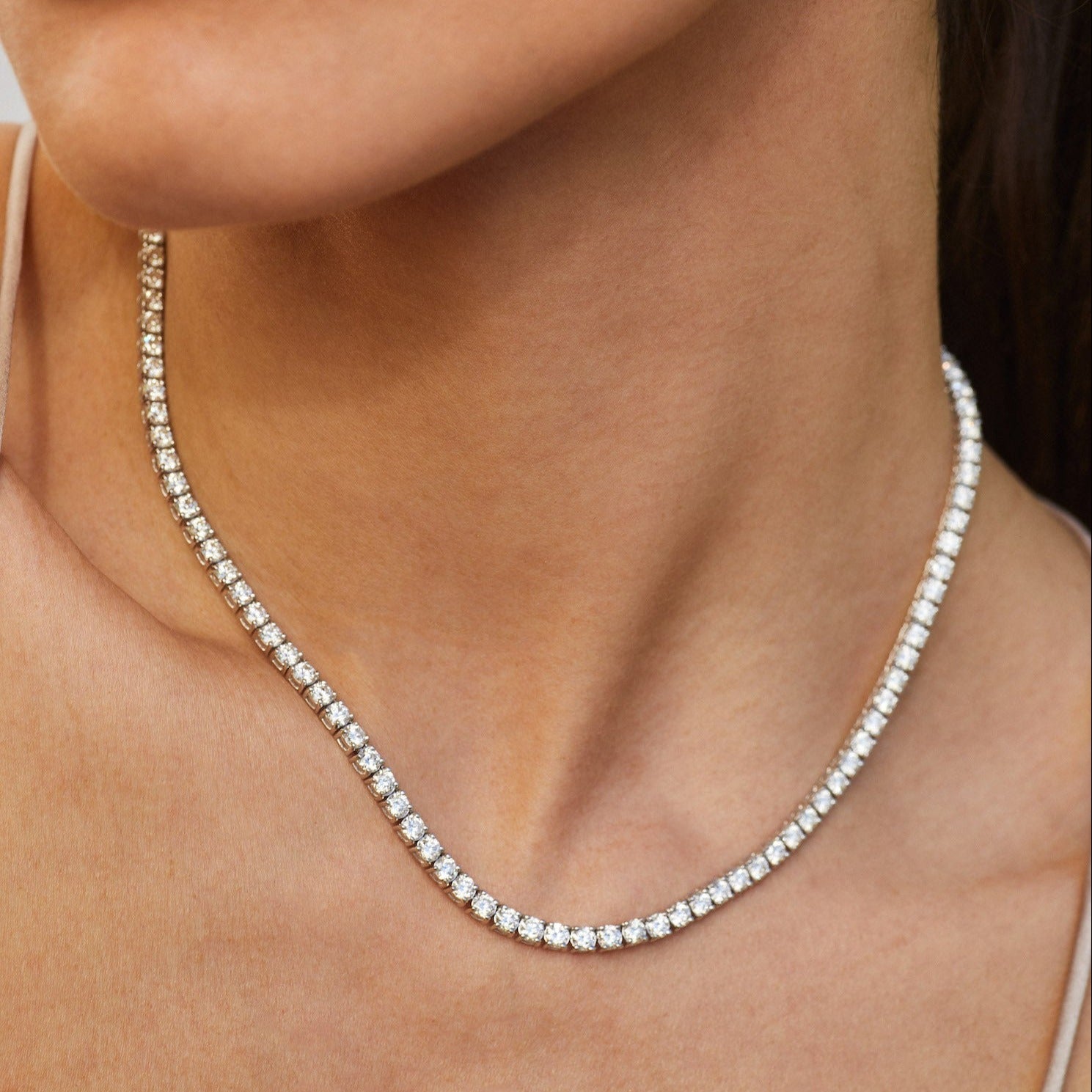 Diamond Tennis Necklace in white gold styled on neck of model