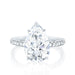 The Jessica Engagement Ring with pear shaped center diamond and micro pave diamonds on platinum gold band