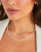 7 Prong Set Diamond Necklace styled on neck of model with diamond necklaces