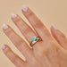 The Seaside Treasure Gift Set in 14k yellow gold styled on middle finger of model