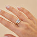 The Love Treasure Gift Set in 14k yellow gold styled on middle finger of model
