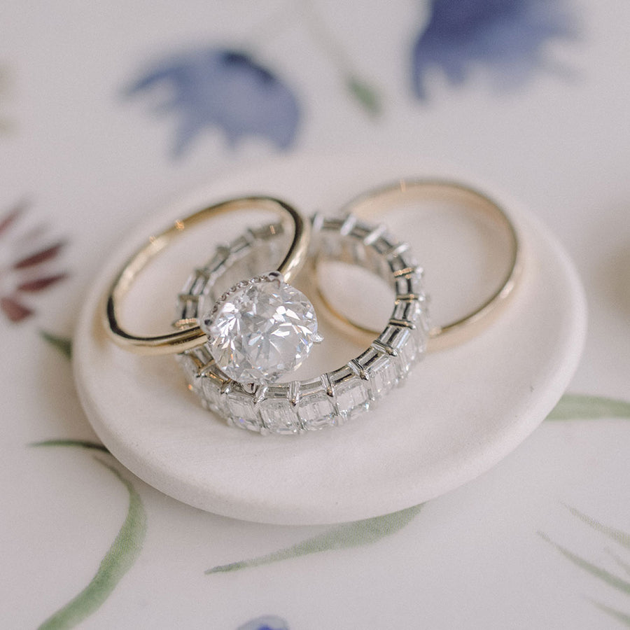 EF Collection diamond engagement rings and wedding bands on dish