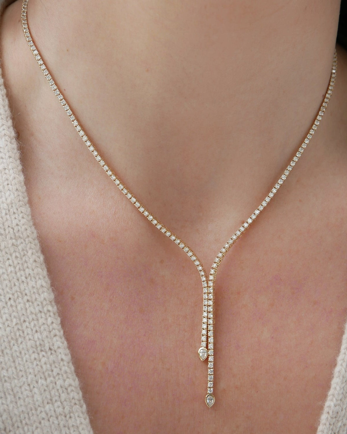 Diamond Lily Necklace in 14k yellow gold styled on neck of model