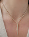 Diamond Lily Necklace in 14k yellow gold styled on neck of model