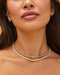Sienna Chain Necklace in 14k yellow gold styled on neck of model with diamond tennis necklace