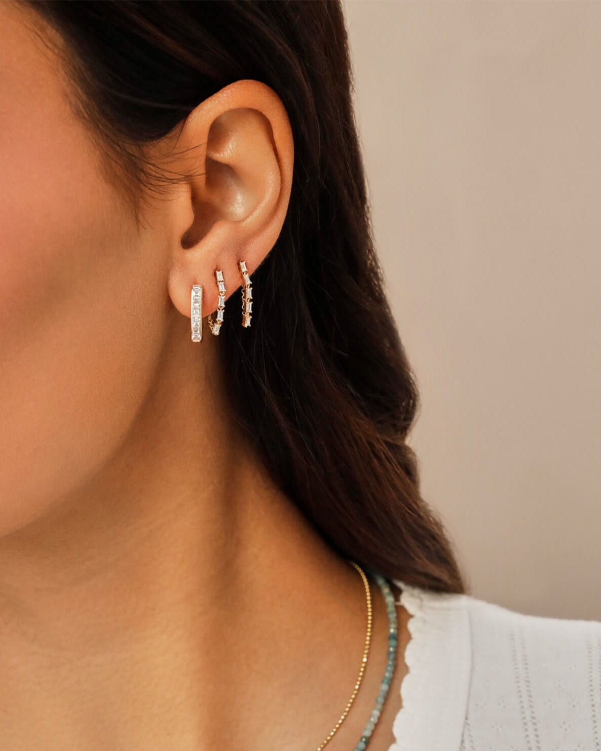 Diamond Baguette Jumbo Lola Hoop Earring in 14k yellow gold styled on ear lobe of model