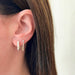 Diamond Baguette Jumbo Lola Hoop Earring in 14k yellow gold styled on ear lobe of model