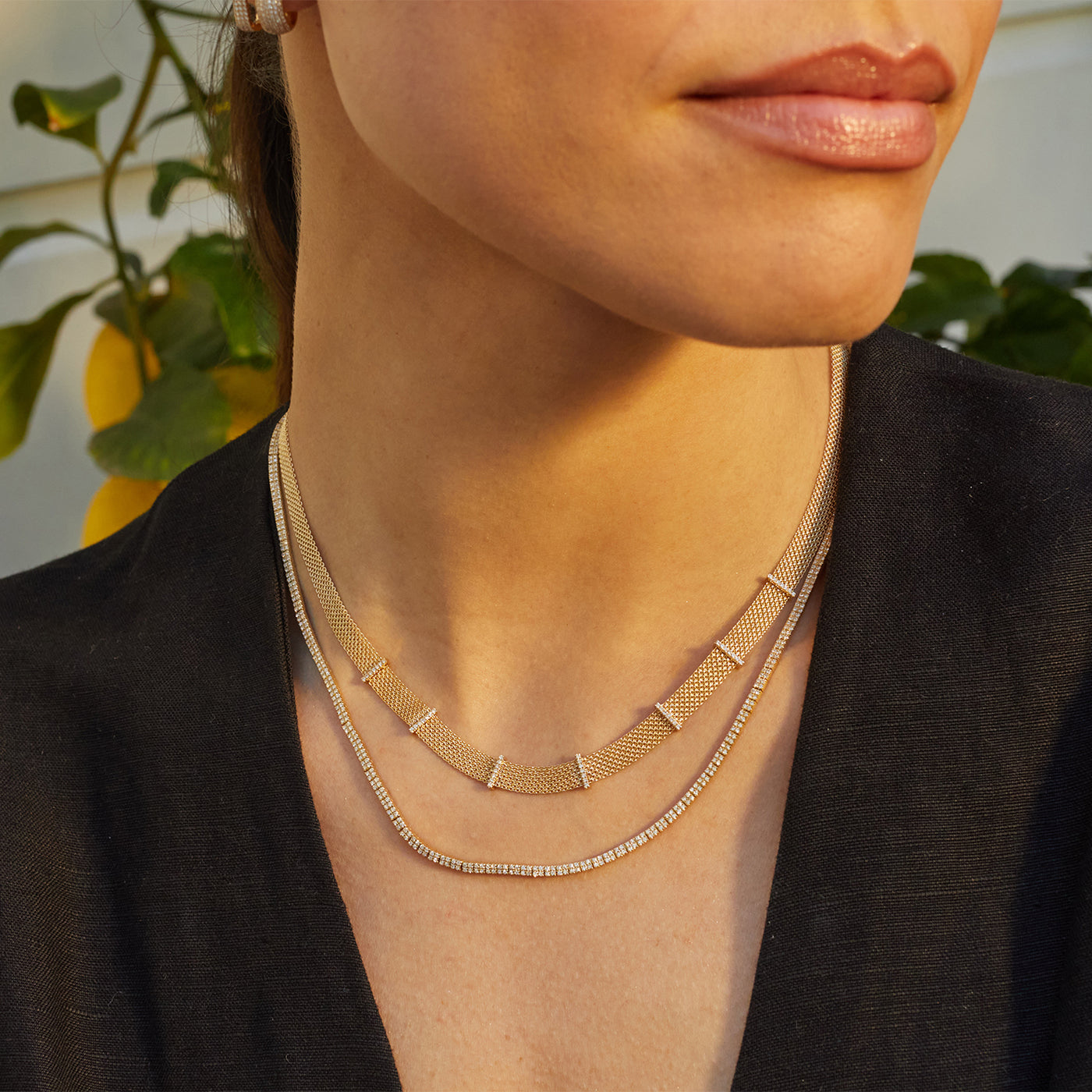 Margo Necklace in 14k yellow gold styled on neck of model with mesh necklace and model wearing black blouse