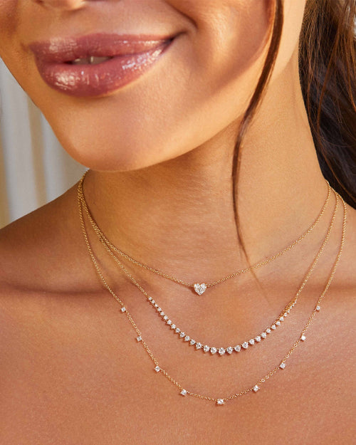 9 Prong Set Diamond Necklace in 14k yellow gold styled on neck of model