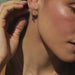 Diamond Bar Mesh Ring in 14k yellow gold styled on finger of model tucking hair behind ear with no model