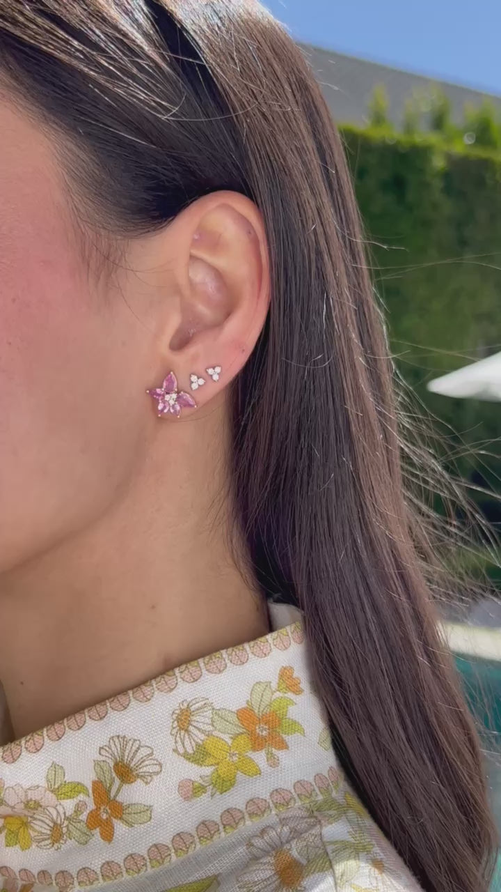 Pink Sapphire & Diamond Trio Cluster Stud Earring styled on first earring hole of model next to two diamond trio stud earrings with no audio
